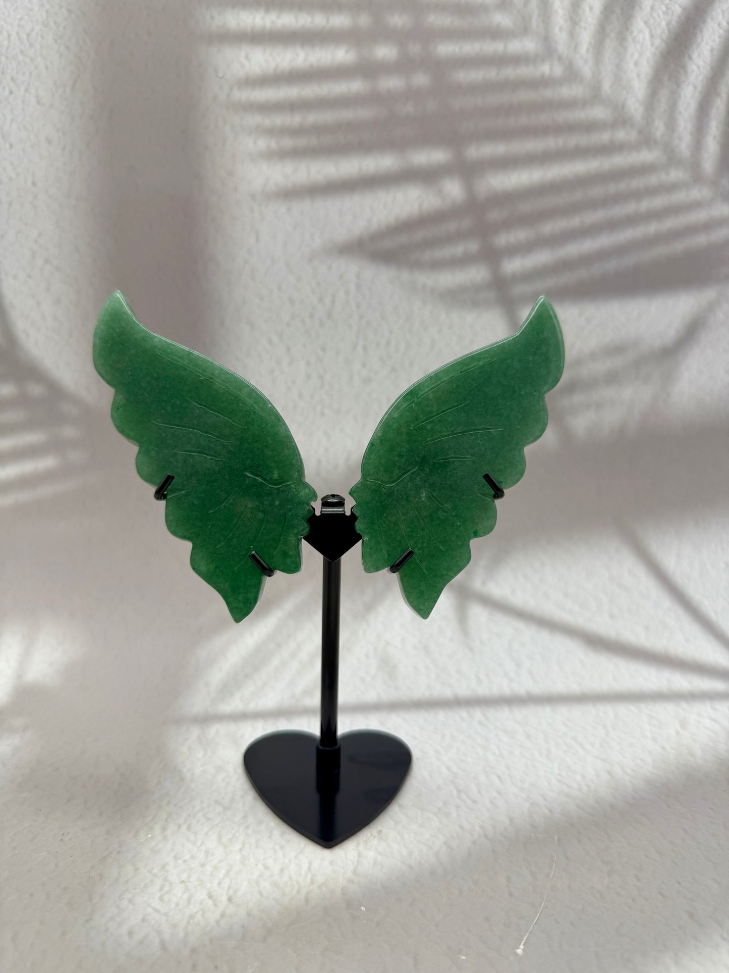 Küssende Gesichter auf Ständer